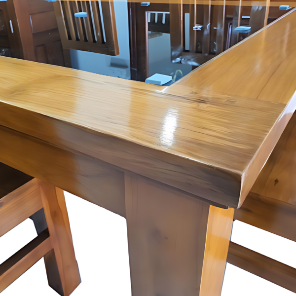 The dining table is meticulously crafted with smoothened edges and seamless connections, offering both safety and aesthetic appeal. The edges of the table are gently rounded, creating a refined look while preventing sharp corners that could cause discomfort or injury. The joints and connections are expertly designed, ensuring a sturdy and stable structure without visible gaps or rough spots. This attention to detail not only enhances the table's visual elegance but also contributes to its long-lasting durability, making it a perfect centerpiece for any dining space.